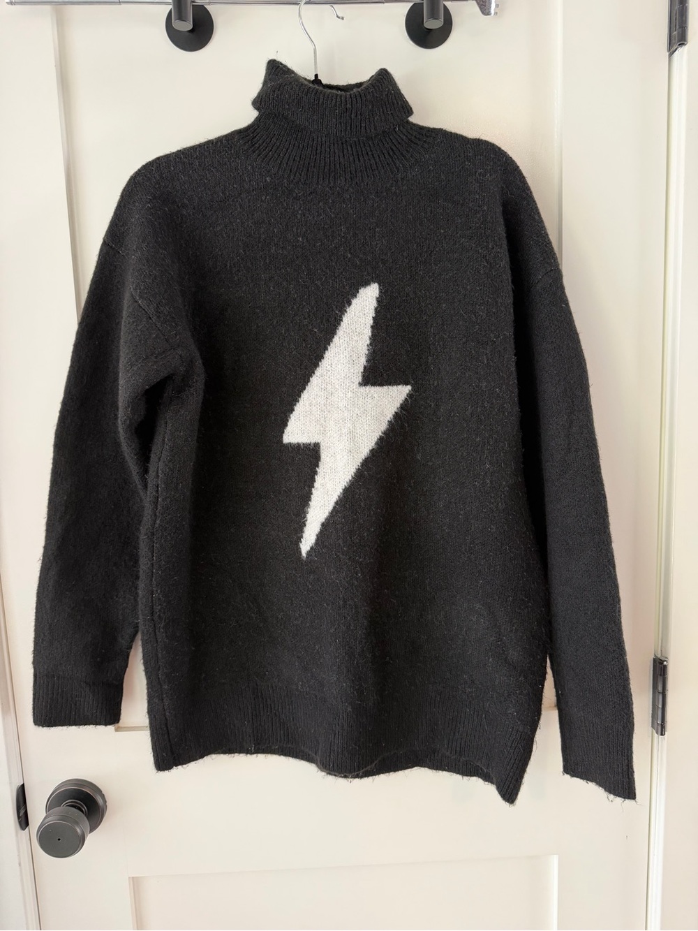 Storia Black Turtleneck Sweater with White Lightning Bolt